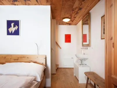 Ein Bett oder Betten in einem Zimmer der Unterkunft Holiday Home Spycher Niederwald by Interhome