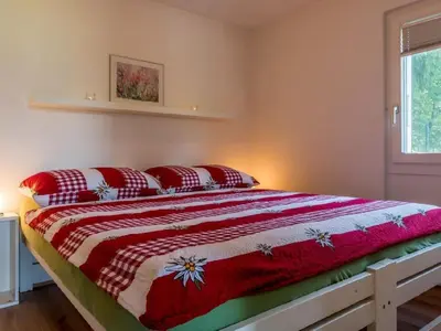 Ein Bett oder Betten in einem Zimmer der Unterkunft Apartment Chalet Lara by Interhome