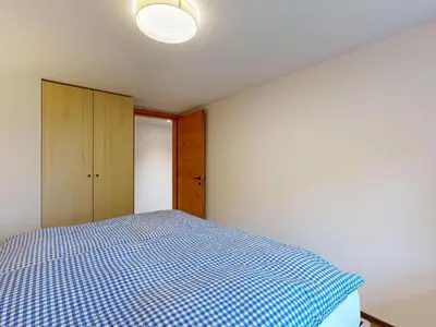 Ein Bett oder Betten in einem Zimmer der Unterkunft Apartment Chalet Wieseli by Interhome