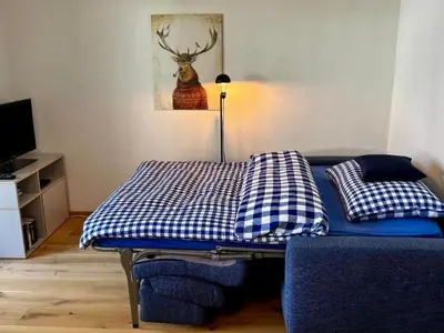 Ein Bett oder Betten in einem Zimmer der Unterkunft Apartment Gemütliche Ferienwohnung im Zentrum Sörenberg by Interhome