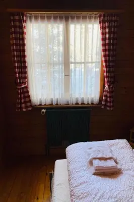 Ein Bett oder Betten in einem Zimmer der Unterkunft Apartment Chalet Bacchus - EG by Interhome
