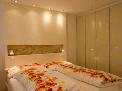 Ein Bett oder Betten in einem Zimmer der Unterkunft Apartment Haus Cristal 39 by Interhome