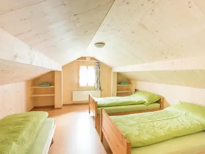 Ein Bett oder Betten in einem Zimmer der Unterkunft Holiday Home Wüthrich by Interhome