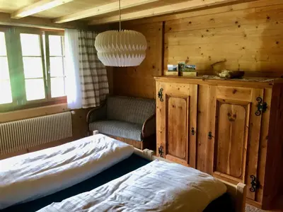 Ein Bett oder Betten in einem Zimmer der Unterkunft Chalet Ried Naturpark Diemtigtal