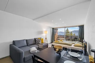 Ein Sitzbereich in der Unterkunft Studio avec balcon & vue dégagée, Anzère centre
