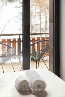 Ein Bett oder Betten in einem Zimmer der Unterkunft L'Ours des Pistes l Ski in-out l By CosyHome