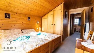 Ein Bett oder Betten in einem Zimmer der Unterkunft Haus Chämihitta, Riederalp Moosfluh
