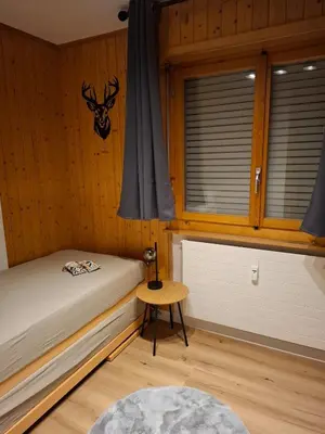 Ein Bett oder Betten in einem Zimmer der Unterkunft The Edelweiss - Cozy apartment in Anzère