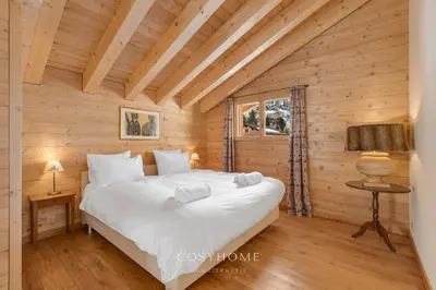Ein Bett oder Betten in einem Zimmer der Unterkunft Le Chalet Marmotte - Family - By CosyHome