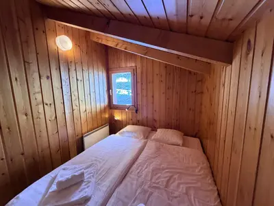 Ein Bett oder Betten in einem Zimmer der Unterkunft Fontannets 001 COSY & MOUNTAIN chalet 10 pers