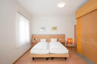 Ein Bett oder Betten in einem Zimmer der Unterkunft Hotel-Restaurant Eyholz