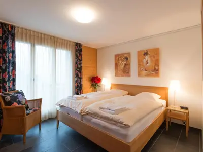 Ein Bett oder Betten in einem Zimmer der Unterkunft Apartment Silberhorn Apt- DW by Interhome