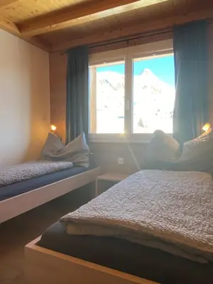 Ein Bett oder Betten in einem Zimmer der Unterkunft Bim See