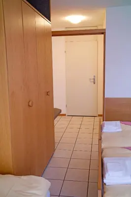 Ein Bett oder Betten in einem Zimmer der Unterkunft Hotel Lötschberg