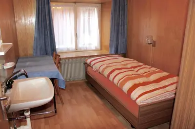 Ein Bett oder Betten in einem Zimmer der Unterkunft Mittaghornblick