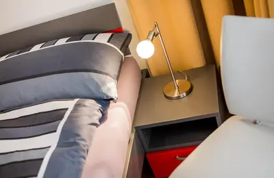 Ein Bett oder Betten in einem Zimmer der Unterkunft Residenz Ambassador