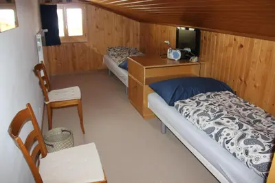 Ein Bett oder Betten in einem Zimmer der Unterkunft Chalet Mittaghorn
