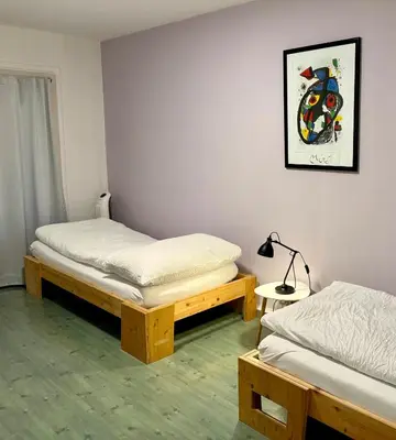 Ein Bett oder Betten in einem Zimmer der Unterkunft Downtown Apartments