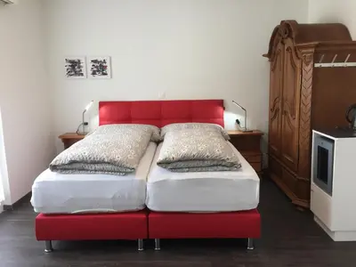 Ein Bett oder Betten in einem Zimmer der Unterkunft Römerhof - Hotel with Self Check-in