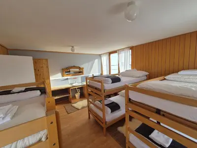 Ein Bett oder Betten in einem Zimmer der Unterkunft Tignousa logement de groupes et individuels