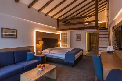 Ein Bett oder Betten in einem Zimmer der Unterkunft Alpen Resort & Spa