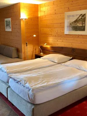 Ein Bett oder Betten in einem Zimmer der Unterkunft Hotel Châlet Du Lac