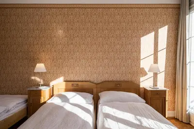 Ein Bett oder Betten in einem Zimmer der Unterkunft Hotel Regina