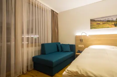Ein Bett oder Betten in einem Zimmer der Unterkunft Hotel Matterhorn Inn