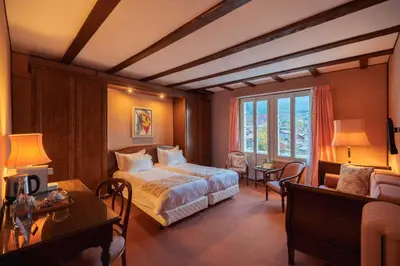 Ein Bett oder Betten in einem Zimmer der Unterkunft Hotel Regina