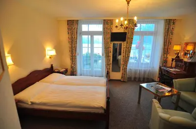 Ein Bett oder Betten in einem Zimmer der Unterkunft Seiler au Lac