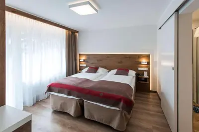 Ein Bett oder Betten in einem Zimmer der Unterkunft Hotel Butterfly