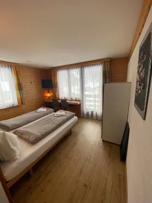 Ein Bett oder Betten in einem Zimmer der Unterkunft Hotel Garni Jägerhof