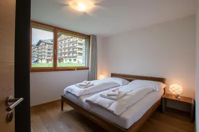 Ein Bett oder Betten in einem Zimmer der Unterkunft Alpenresort B22