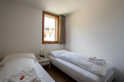Ein Bett oder Betten in einem Zimmer der Unterkunft Alpenresort B22