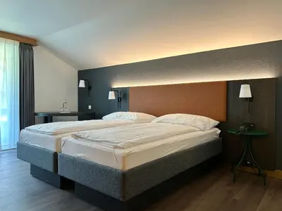 Ein Bett oder Betten in einem Zimmer der Unterkunft Hotel Alpin Superior