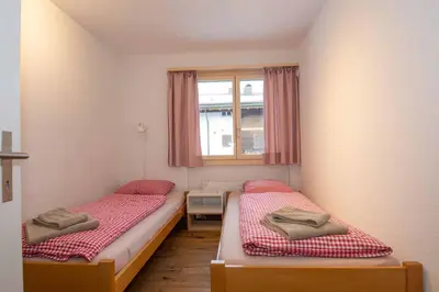 Ein Bett oder Betten in einem Zimmer der Unterkunft Ferienwohnung Titschermatte