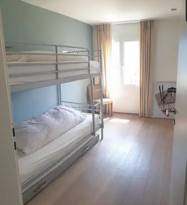 Ein Bett oder Betten in einem Zimmer der Unterkunft Hotel Jungfrau Mürren
