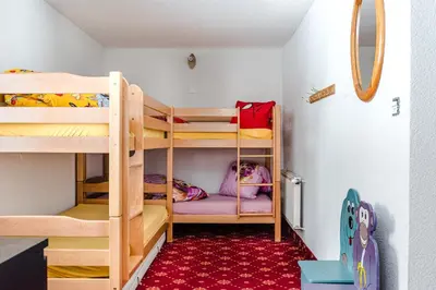 Ein Bett oder Betten in einem Zimmer der Unterkunft Family Hotel Desirée