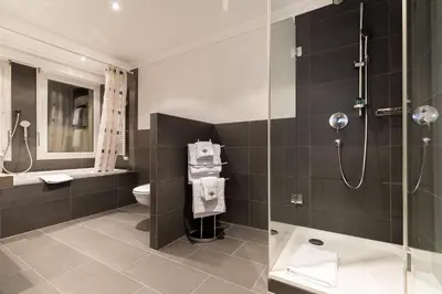 Ein Badezimmer in der Unterkunft Hotel Central, SPA & LOUNGE BAR