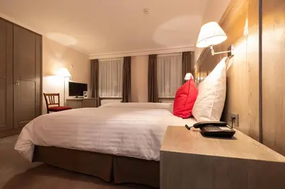 Ein Bett oder Betten in einem Zimmer der Unterkunft Hotel Central, SPA & LOUNGE BAR