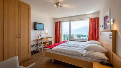Ein Bett oder Betten in einem Zimmer der Unterkunft Hôtel Splendide