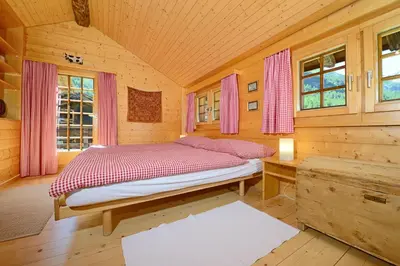 Ein Bett oder Betten in einem Zimmer der Unterkunft Chalet Tuk-Tuk