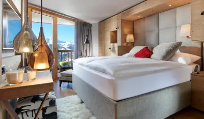 Ein Bett oder Betten in einem Zimmer der Unterkunft Chandolin Boutique Hotel