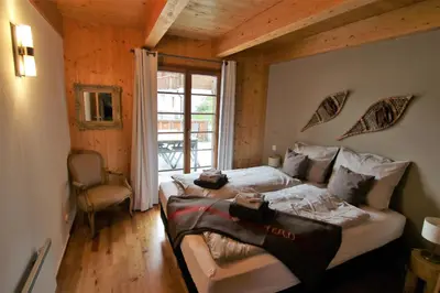 Ein Bett oder Betten in einem Zimmer der Unterkunft Mountain Village Chalet