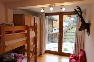 Ein Bett oder Betten in einem Zimmer der Unterkunft Mountain Village Chalet