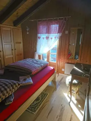 Ein Bett oder Betten in einem Zimmer der Unterkunft Chalet 