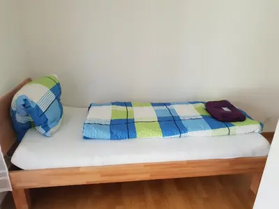 Ein Bett oder Betten in einem Zimmer der Unterkunft Swiss Holidays-City Apartments Interlaken