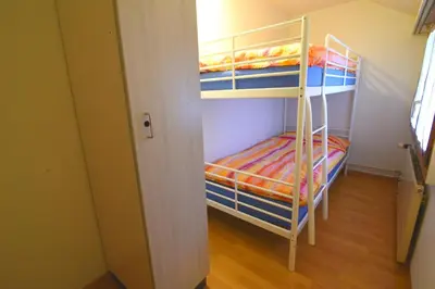 Ein Etagenbett oder Etagenbetten in einem Zimmer der Unterkunft The River Holiday Apartment