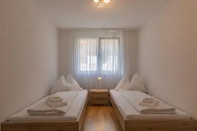 Ein Bett oder Betten in einem Zimmer der Unterkunft Mönch Apartment - Aare Jungfrau AG