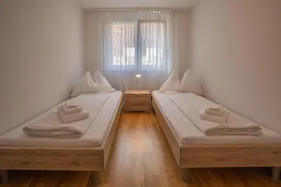 Ein Bett oder Betten in einem Zimmer der Unterkunft Mönch Apartment - Aare Jungfrau AG